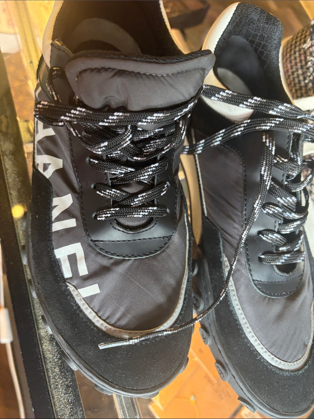 CHANEL Black Sneakers with White Logo Accents